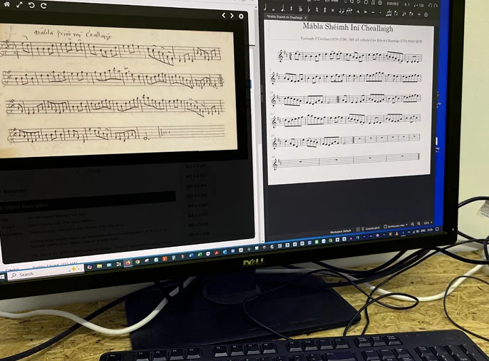 screenshot of computer screen with both handwritten musical notation and transcribed digital notation 